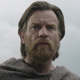 Obi-Wan Kenobi looks concernedly into his cave from desert.